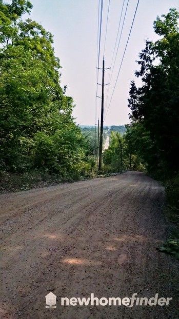 Park in enlarged areas at side of dirt roads to access trails