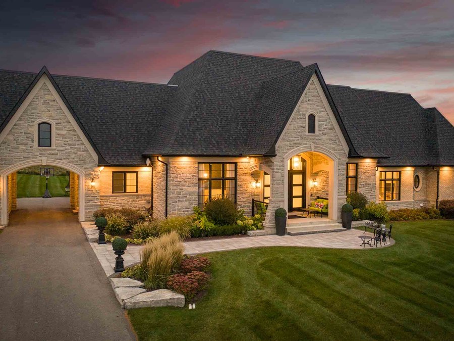 Stone and brick custom home entry by Stellar Homes